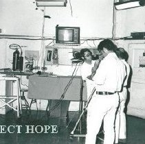 First medical satellite transmission. Patient appears on TV screen.